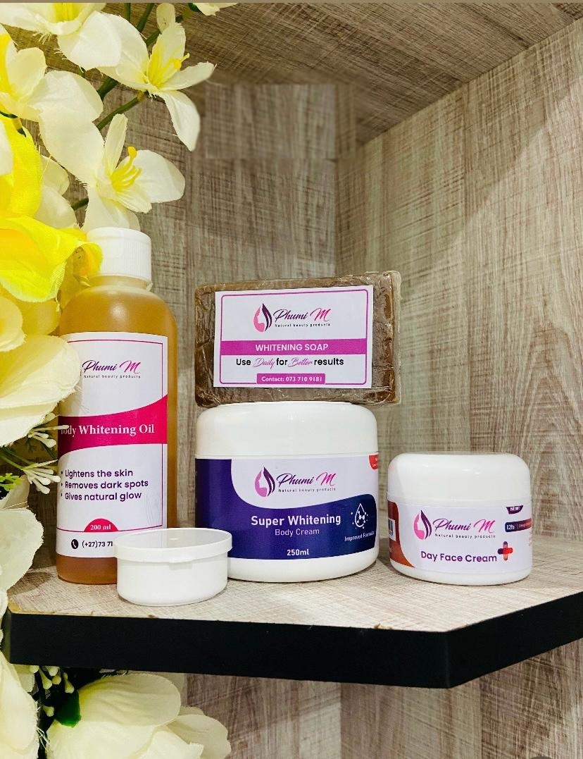 The Phumi M skincare package — Glowing Body Cream, Super Whitening Body Cream, face cream and glow soap, authentic product photograph